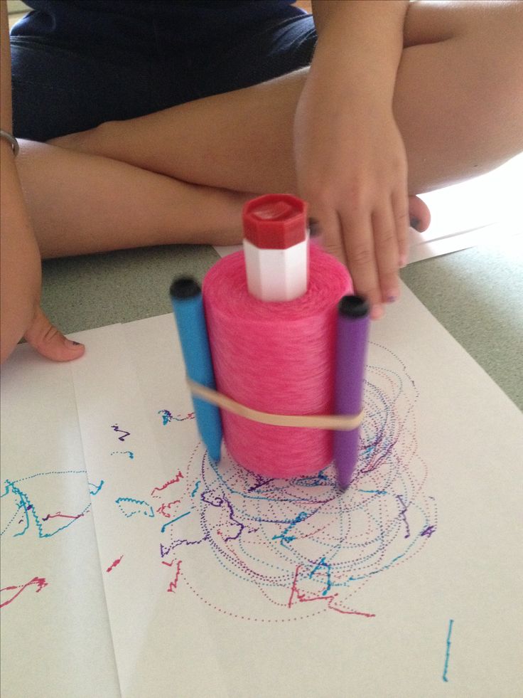 A coloring machine comprised of an electric toothbrush motor stuck inside a piece of pool noodle with markers attached to the outside by a rubberband.