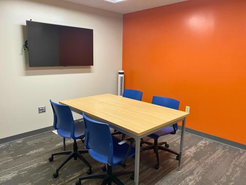 conference room with four chairs around a table