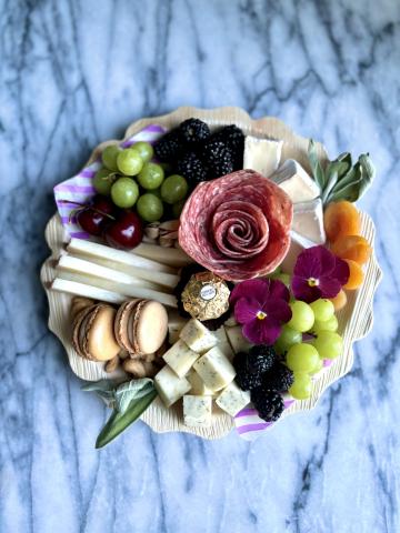 A charcuterie board with many ingredients.