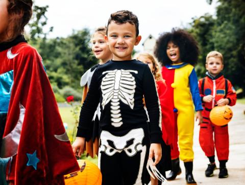 Costumed children participating in Trick or Treat.