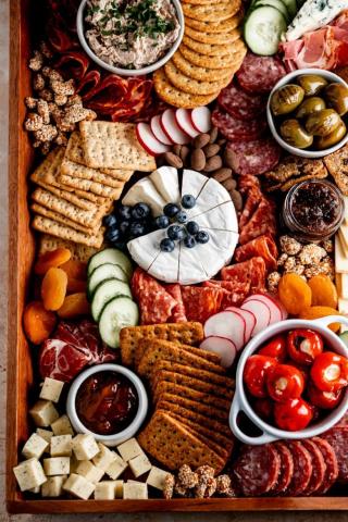 board with cheese, meat and fruit