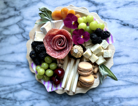 A charcuterie board with many ingredients.