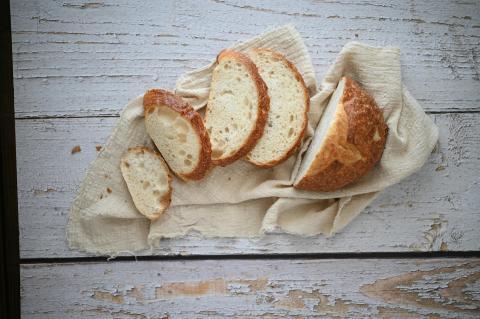 A loaf of sourdough bread sliced and spread out.