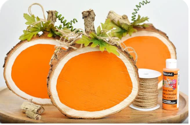 Wood slices painted to resemble pumpkins