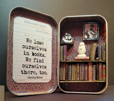 Mini bookshelf in tin complete with tiny books and a quote on a vintage library slip