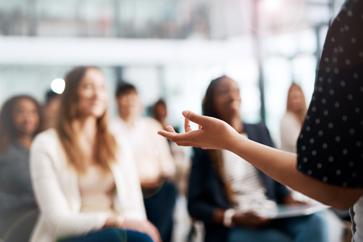 Presenter speaking to adults