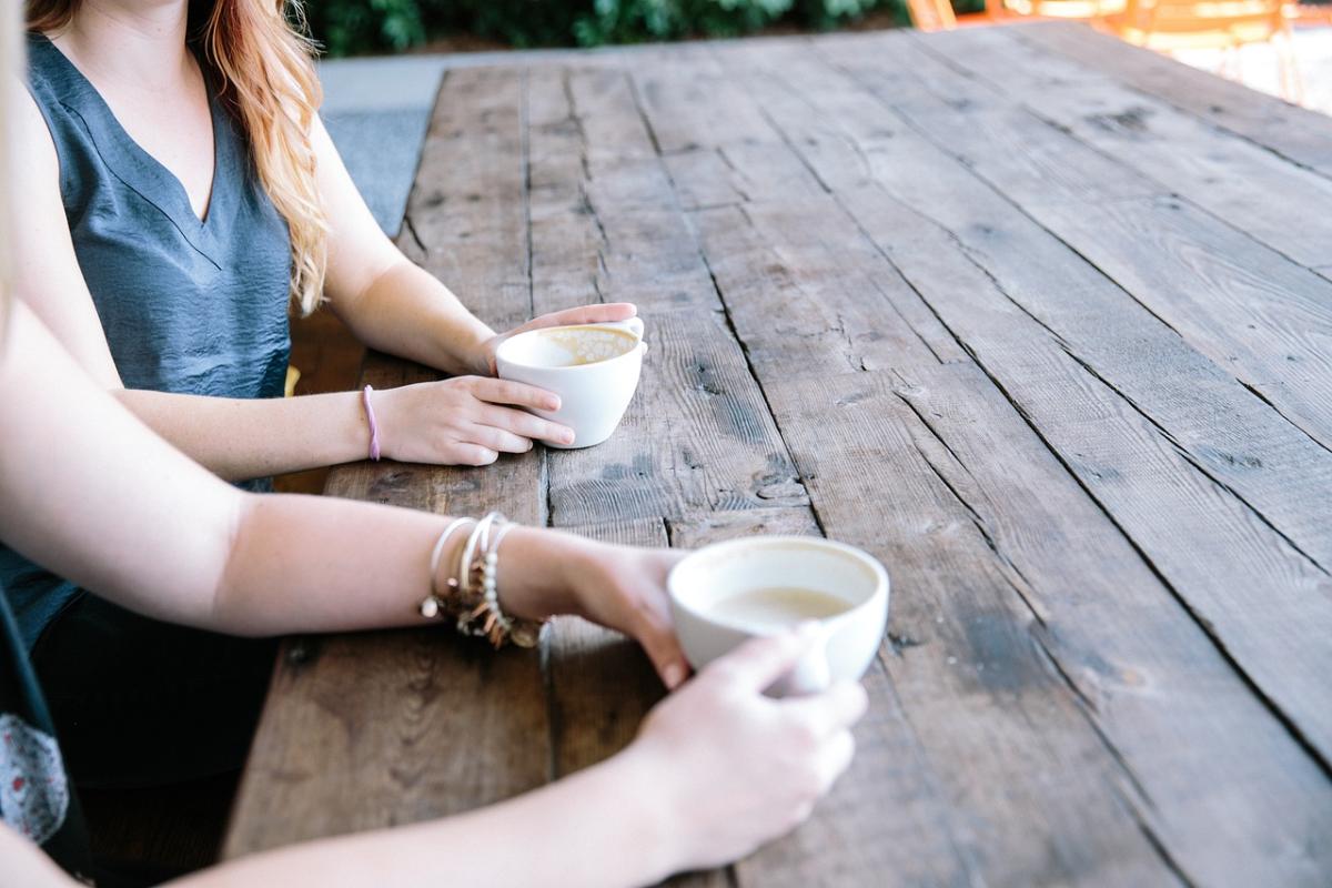 people talking over coffee